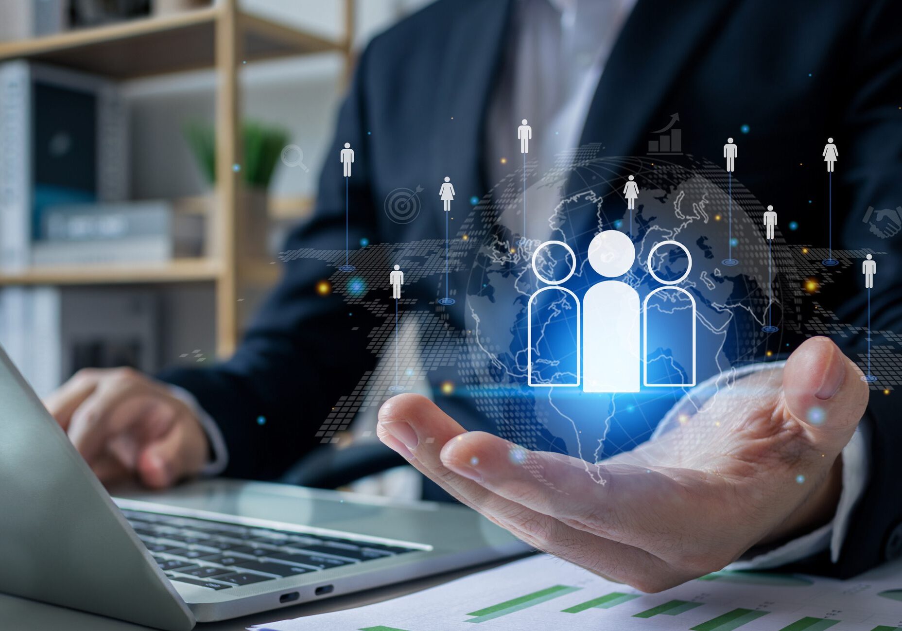 Person using laptop with virtual icons