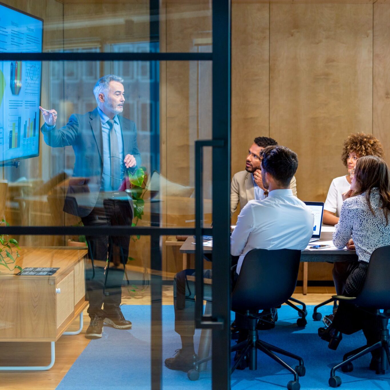 Team discussing presentation in office setting